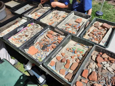 Along with stretches of cobblestone path, researchers found pottery and Roman coins.