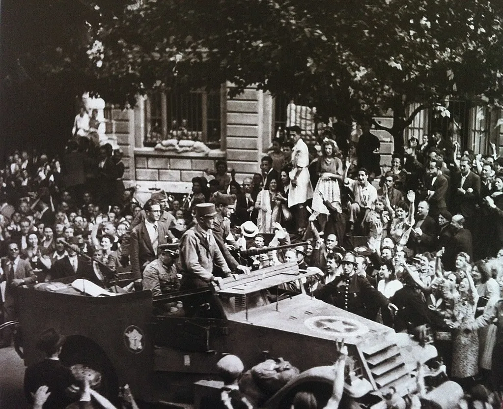 Choltitz, seated in car, is driven through the streets of Paris after surrendering to the Allies.