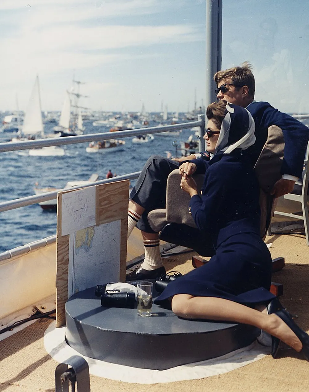 John and his wife, Jackie Kennedy, watch a boat race while on board the USS Joseph P. Kennedy Jr., a destroyer named in Joe Jr.'s honor