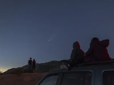 Stargazers watch Comet Neowise shoot across the sky on July 19, 2020 outside of Los Angeles, California.