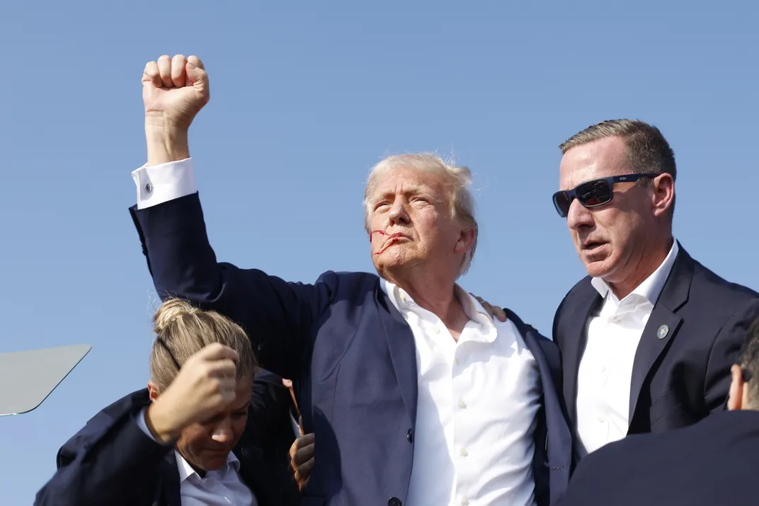 Former President Donald Trump is rushed offstage during a rally on July 13, 2024 in Butler, Pennsylvania.