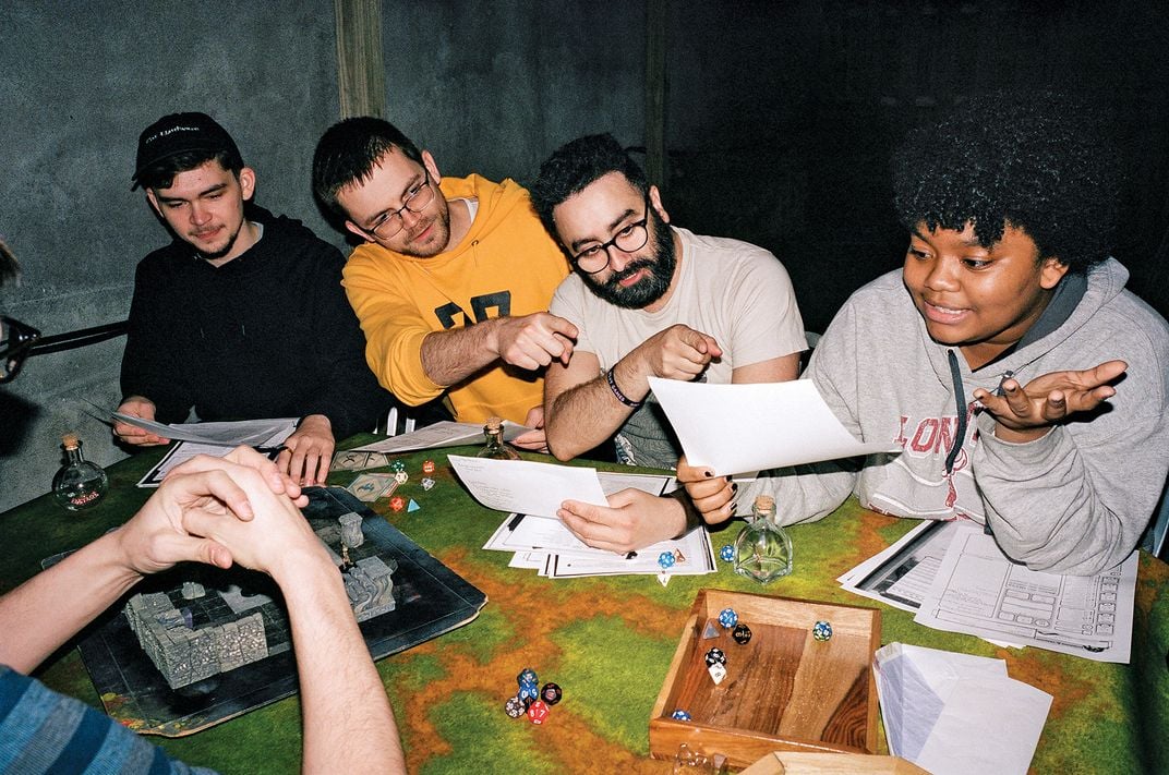 a group of people playing dungeon and dragons