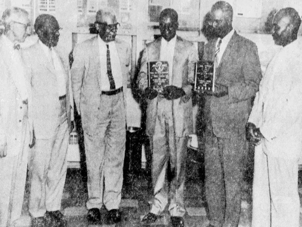 A 1959 photograph of Saxon, who is standing third from left